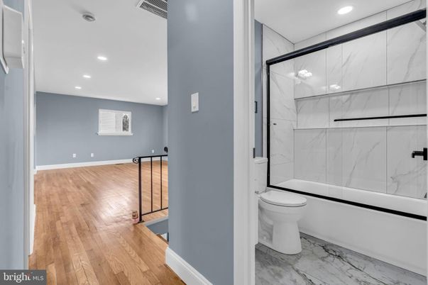 Bathroom, Glass Shower, Interior, Marble, Marble Walls, Recessed Lighting, Wood Texture Flooring