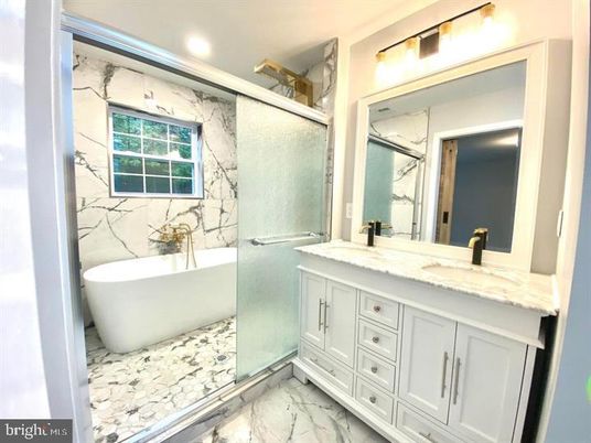 Bathroom, Dual Sink Vanities, Free Standing Baths, Glass Shower, Interior, Marble, Marble Walls, Recessed Lighting