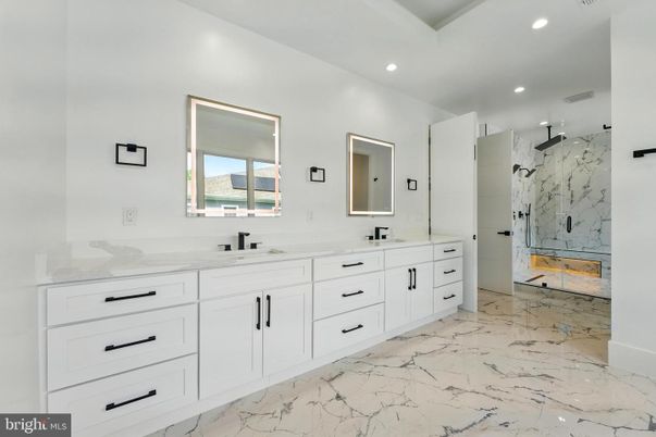 Bathroom, Dual Sink Vanities, Glass Shower, Interior, Marble, Marble Walls, Recessed Lighting