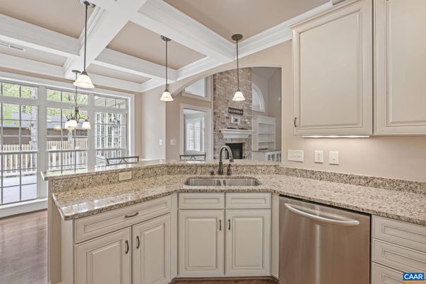 Fireplace, Interior, Kitchen, Pendant Lights, Stainless Steel Appliances, Stone Walls, Wood Texture Flooring