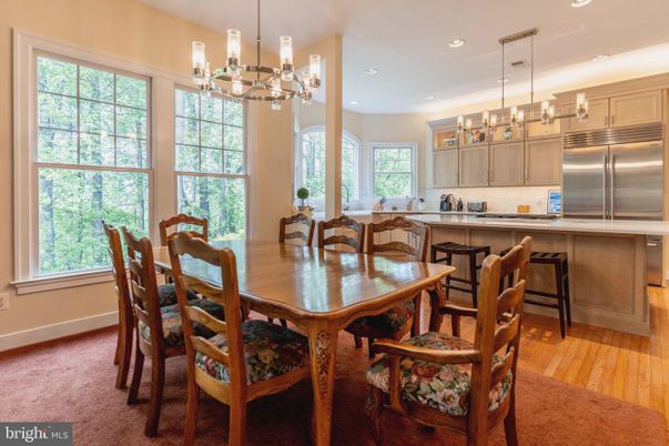 Chandelier, Dining room, Interior, Kitchen, Pendant Lights, Recessed Lighting, Stainless Steel Appliances, Wood Texture Flooring