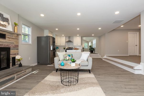 Fireplace, Interior, Kitchen, Living room, Recessed Lighting, Stainless Steel Appliances, Wood Texture Flooring