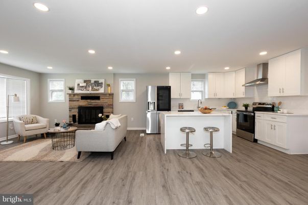Fireplace, Interior, Kitchen, Living room, Recessed Lighting, Stainless Steel Appliances, Wood Texture Flooring