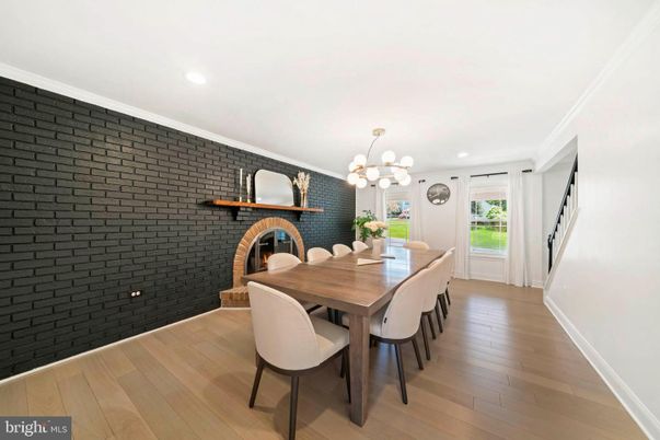 Chandelier, Dining room, Fireplace, Interior, Recessed Lighting, Stone Walls, Wood Texture Flooring