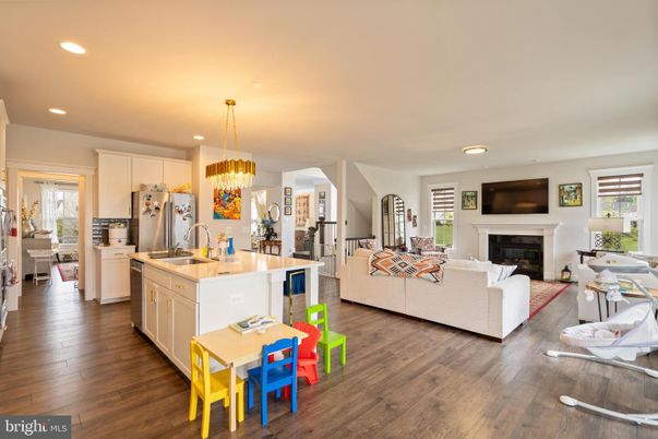 Chandelier, Dining room, Fireplace, Interior, Kitchen, Living room, Pendant Lights, Recessed Lighting, Wood Texture Flooring