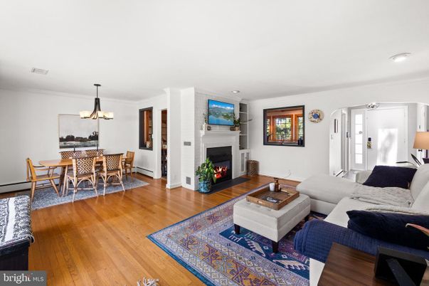 Chandelier, Dining room, Fireplace, Interior, Living room, Pendant Lights, Recessed Lighting, Wood Texture Flooring