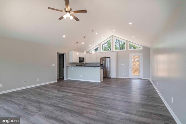 Empty room, Interior, Kitchen, Pendant Lights, Recessed Lighting, Stainless Steel Appliances, Wood Texture Flooring