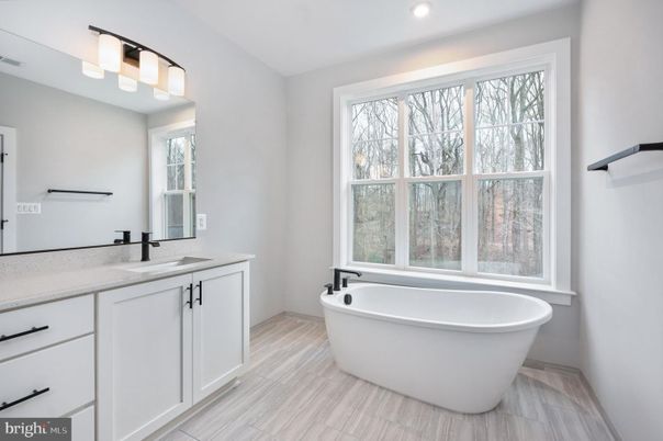 Bathroom, Dual Sink Vanities, Free Standing Baths, Interior, Recessed Lighting, Wood Texture Flooring