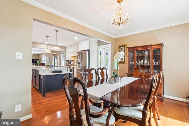 Chandelier, Dining room, Interior, Kitchen, Pendant Lights, Recessed Lighting, Stainless Steel Appliances, Wood Texture Flooring