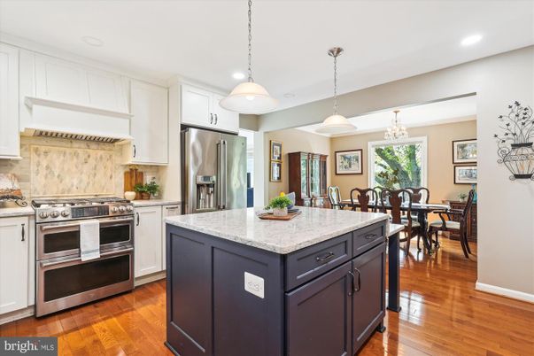 Chandelier, Dining room, Interior, Kitchen, Pendant Lights, Recessed Lighting, Stainless Steel Appliances, Wood Texture Flooring