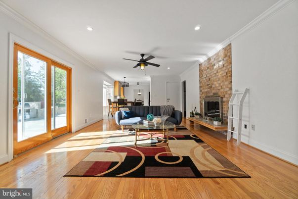 Fireplace, Interior, Living room, Recessed Lighting, Stone Walls, Wood Texture Flooring