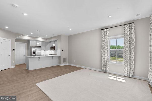 Empty room, Interior, Kitchen, Pendant Lights, Recessed Lighting, Stainless Steel Appliances, Wood Texture Flooring