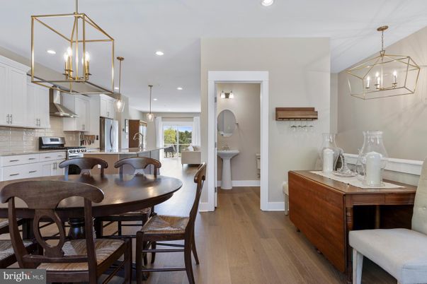 Dining room, Interior, Kitchen, Pendant Lights, Recessed Lighting, Stainless Steel Appliances, Wood Texture Flooring