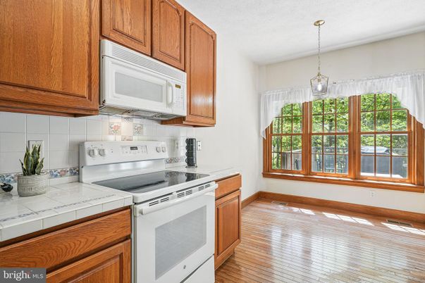 Interior, Kitchen, Pendant Lights, Tile Countertops, Wood Texture Flooring