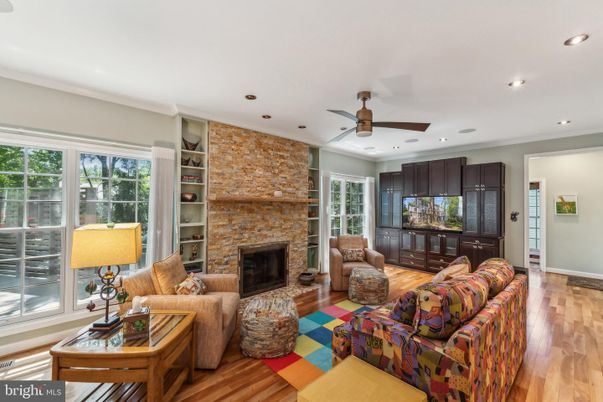 Fireplace, Interior, Living room, Recessed Lighting, Stone Walls, Wood Texture Flooring