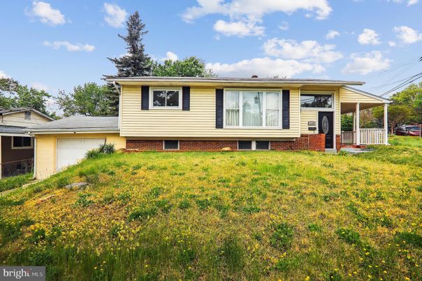 Attached, Backyard, Exterior, Facade, Brick Facade, Raised Ranch