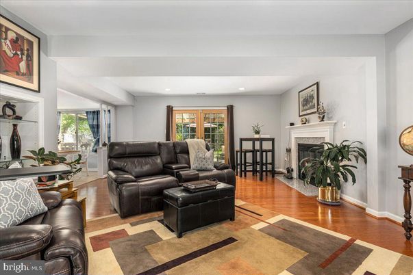 Dining room, Fireplace, Interior, Living room, Recessed Lighting, Wood Texture Flooring