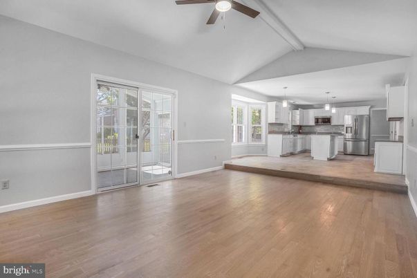 Empty room, Interior, Kitchen, Pendant Lights, Stainless Steel Appliances, Wood Texture Flooring
