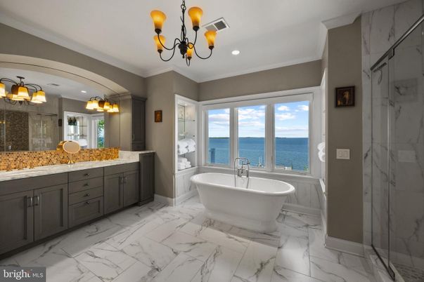 Bathroom, Dual Sink Vanities, Free Standing Baths, Glass Shower, Interior, Marble, Marble Walls, Recessed Lighting, Water