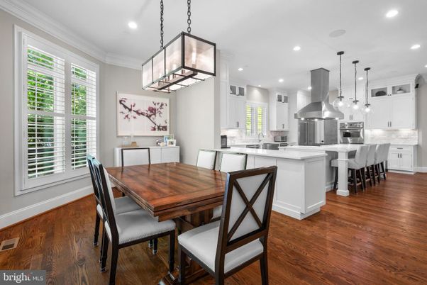 Dining room, Interior, Kitchen, Pendant Lights, Recessed Lighting, Stainless Steel Appliances, Wood Texture Flooring