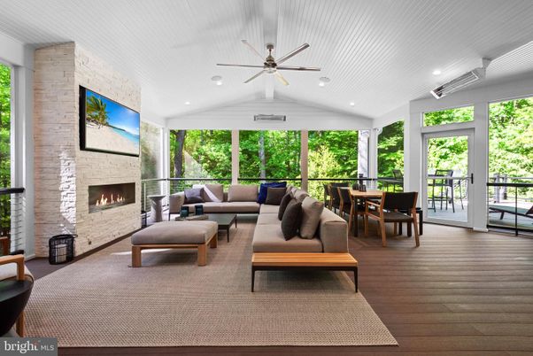 Dining room, Fireplace, Interior, Living room, Recessed Lighting, Stone Walls, Wood Texture Flooring