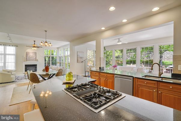 Dining room, Fireplace, Interior, Kitchen, Living room, Pendant Lights, Recessed Lighting, Stainless Steel Appliances, Wood Texture Flooring