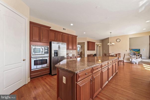 Chandelier, Dining room, Interior, Kitchen, Recessed Lighting, Stainless Steel Appliances, Wood Texture Flooring