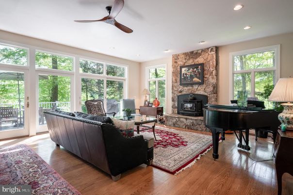 Fireplace, Interior, Living room, Piano, Recessed Lighting, Stone Walls, Wood Texture Flooring