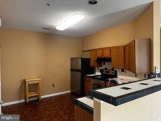Interior, Kitchen, Tile Countertops, Wood Texture Flooring