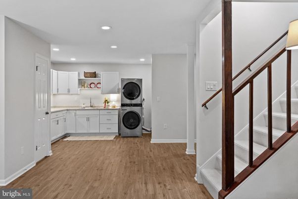 Interior, Kitchen, Recessed Lighting, Washer, Wood Texture Flooring
