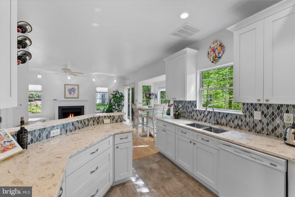 Dining room, Fireplace, Interior, Kitchen, Recessed Lighting, Wood Texture Flooring