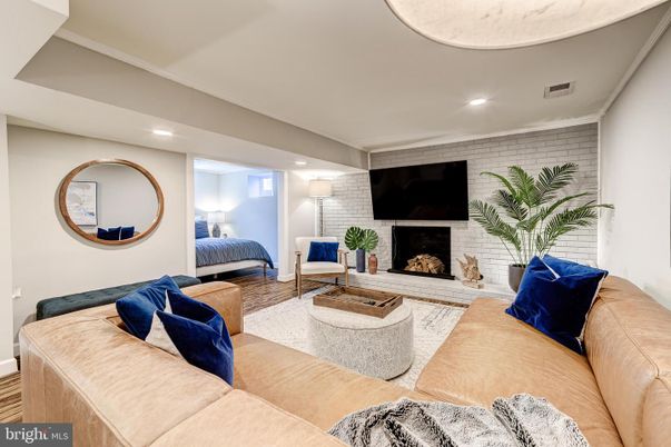 Fireplace, Interior, Living room, Recessed Lighting, Stone Walls, Wood Texture Flooring