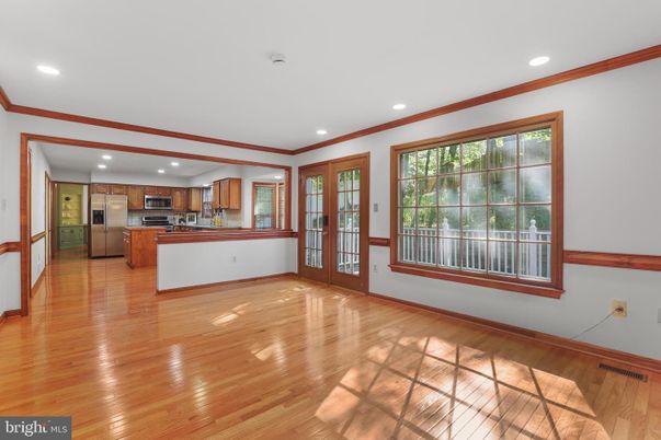 Empty room, Interior, Kitchen, Recessed Lighting, Stainless Steel Appliances, Wood Texture Flooring