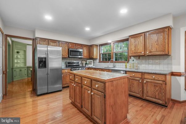 Interior, Kitchen, Recessed Lighting, Tile Countertops, Wood Texture Flooring
