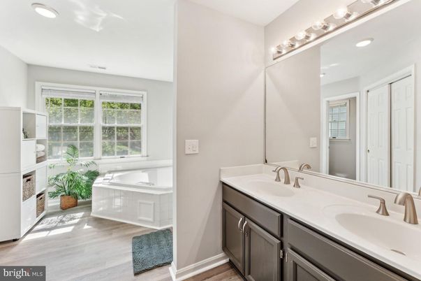 Bathroom, Dual Sink Vanities, Interior, Recessed Lighting, Wood Texture Flooring