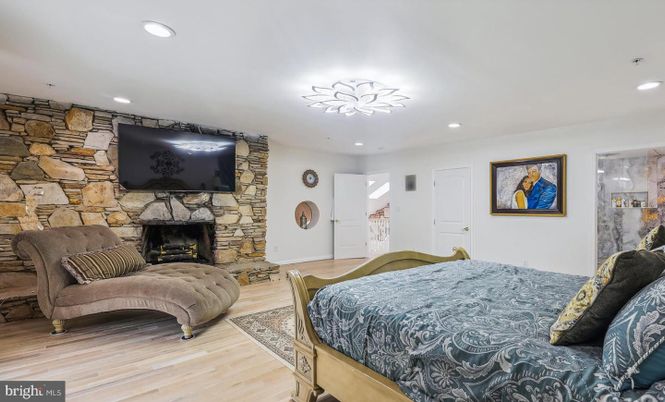 Bedroom, Fireplace, Interior, Recessed Lighting, Stone Walls, Wood Texture Flooring