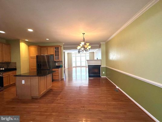 Chandelier, Fireplace, Interior, Kitchen, Recessed Lighting, Stainless Steel Appliances, Wood Texture Flooring