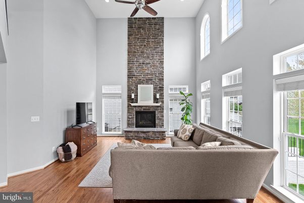 Fireplace, Interior, Living room, Recessed Lighting, Stone Walls, Wood Texture Flooring