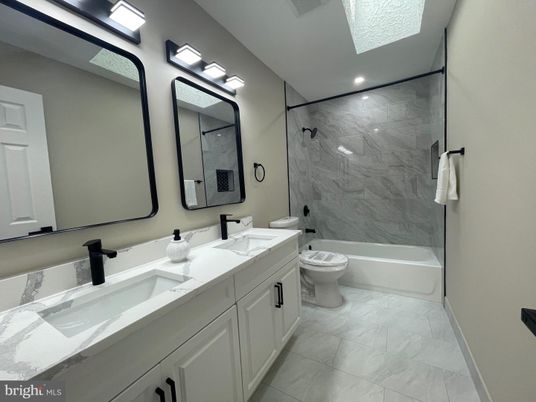 Bathroom, Dual Sink Vanities, Interior, Marble, Marble Walls, Recessed Lighting