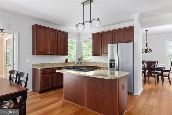 Chandelier, Dining room, Interior, Kitchen, Pendant Lights, Stainless Steel Appliances, Wood Texture Flooring
