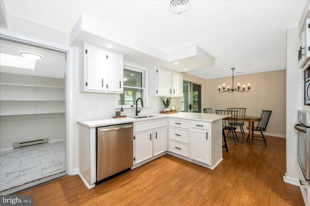 Chandelier, Dining room, Interior, Kitchen, Marble, Recessed Lighting, Stainless Steel Appliances, Wood Texture Flooring