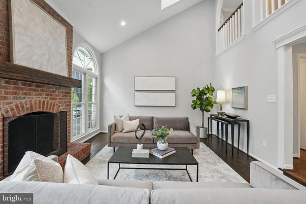 Fireplace, Interior, Living room, Recessed Lighting, Stone Walls, Wood Texture Flooring
