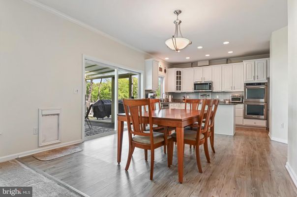 Dining room, Interior, Kitchen, Pendant Lights, Recessed Lighting, Stainless Steel Appliances, Wood Texture Flooring