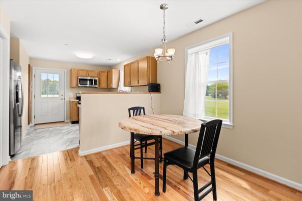 Chandelier, Dining room, Interior, Kitchen, Pendant Lights, Stainless Steel Appliances, Wood Texture Flooring