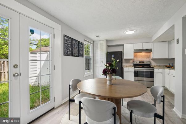 Dining room, Interior, Kitchen, Recessed Lighting, Stainless Steel Appliances, Wood Texture Flooring