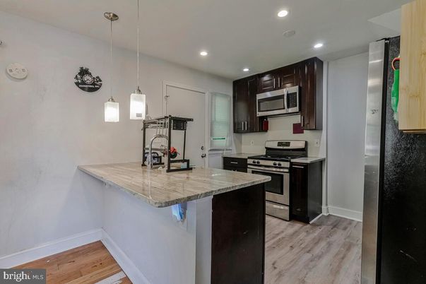Interior, Kitchen, Pendant Lights, Recessed Lighting, Stainless Steel Appliances, Wood Texture Flooring