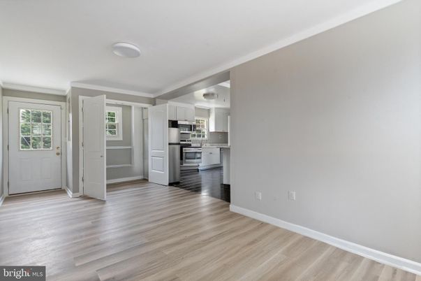 Empty room, Interior, Kitchen, Stainless Steel Appliances, Wood Texture Flooring