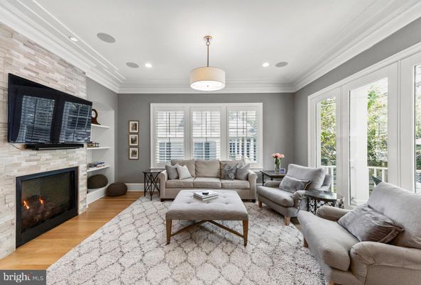 Fireplace, Interior, Living room, Recessed Lighting, Stone Walls, Wood Texture Flooring