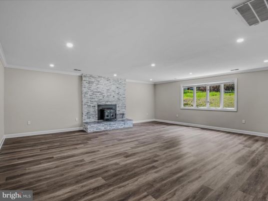Empty room, Fireplace, Interior, Recessed Lighting, Stone Walls, Wood Texture Flooring