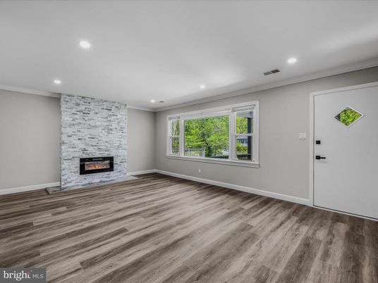 Empty room, Fireplace, Interior, Recessed Lighting, Stone Walls, Wood Texture Flooring